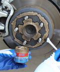 Applying 361 High Temperature Copper Anti Seize from Complete Brake Caliper Grease Kit to brake disc for smooth performance