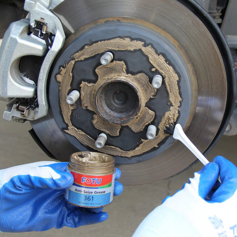 Applying 361 High Temperature Copper Anti Seize from Complete Brake Caliper Grease Kit to brake disc for smooth performance