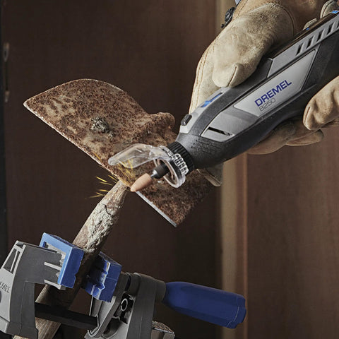Zero Mess Spark Shield And Accessory Bundle For Rotary Tools, Dremel tool cutting metal with sparks and gloves.