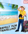 Child with Spiderman Avengers kids carry-on suitcase on tropical vacation