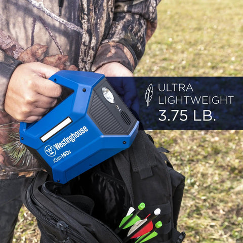 Person holding Go-To Portable Power Station With 155Wh 150W Peak, Solar Generator next to backpack outdoors.