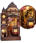 Cherry Blossom Sakura Train Book Nook Kit With LED 3D Wood Puzzle And Infinity Mirror, showing lit train and cherry blossoms.