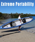 Person carrying Razorlite 473rl Inflatable Drop Stitch Kayak Pro Package with Ultra Portable Rigidity on a beach.