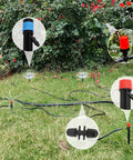 All In One 240 Ft Drip Irrigation Kit with main and distribution tubing installed on a grassy lawn, close-up of emitters.