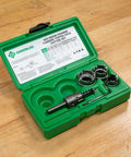 Four Piece Quick Change Carbide Tipped Hole Cutter Set Delivers Fast Precise Holes From Seven Eighths To One And Three Eighths Inches In Stainless Steel Mild Steel Copper And Aluminum With Quick Change Arbor displayed in green case