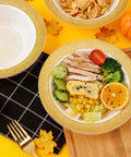 Sturdy Reusable Plastic Bowls With Gleaming Gold Grid Rim, 12 Ounce White Bowls Perfect For Gameday Grills And Big Group Feasts, Bpa Free Food Grade Durable Bulk 100 Pack filled with colorful food.