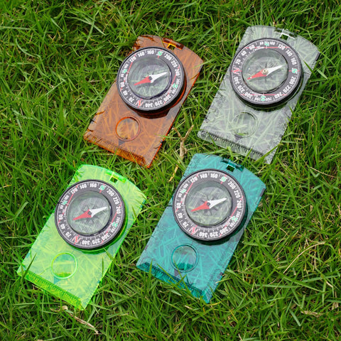 Outdoor Compass Kit With Adjustable Declination, Magnifier, Ruler And Scale, Waterproof Multifunctional Orienteering Compass, 4 Pack on grass