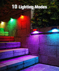 Solar Fence Post Lights 6 Pack With 8 Color Options illuminating stairs in colorful LED lights