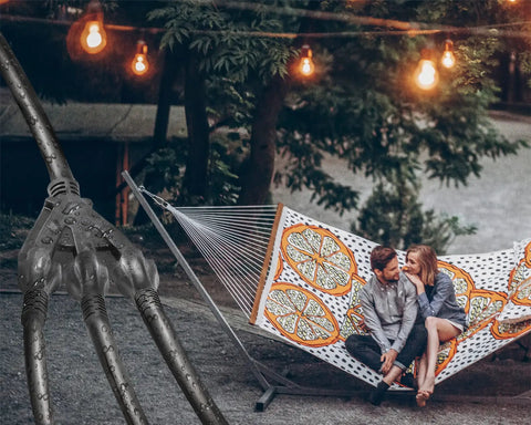 150 Ft 12 Gauge Heavy Duty Black Extension Cord With 3 Outlets by hammock in lit garden at night
