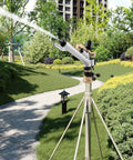 1.5 Inch 360 Degree Impact Adjustable Water Gun Spray Nozzle Set for garden irrigation on tripod, watering greenery.