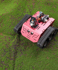 Conqueror Robot Tank Kit With UNO R3 Controller for Arduino on grass illustrating tracked drive and sensor components.