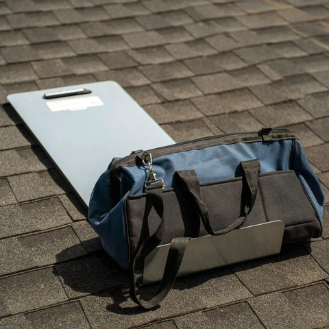 Badass 16 Gauge Pre Galvanized Steel Roofing Shingle Tray 40 By 14 5 Inches resting on shingles next to a tool bag.