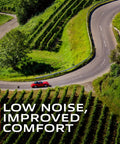 A red car on a winding road with green hills, showcasing low noise and improved comfort from Premium Ceramic Front Disc Brake Pad Set.