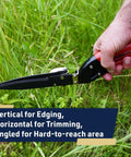 Rotating Handle Grass Shears For Precision Edging And Hedge Trimming, shown in hand with green grass backdrop.
