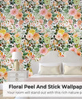 Colorful flower pattern on wall using Peel And Stick Floral Boho Textured Wallpaper For Bedroom And Bathroom Waterproof Removable Renter Friendly Pink Watercolor Modern Look With A Chic Vibe For Kitchen Cabinets 17.5 By 118 Inches behind a bed with white pillows and a white bedside table with a lamp.