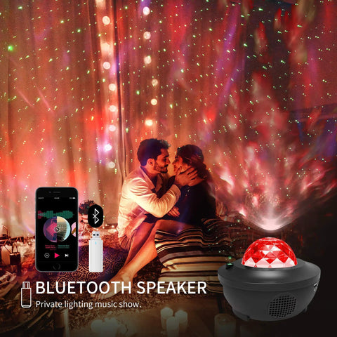 Cozy scene with couple experiencing 3 In 1 Night Light Projector With Bluetooth Speaker And Led Cloud in dark room with star effects.