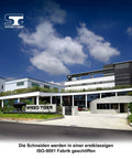 Speed Tiger logo on a modern factory exterior under a blue sky