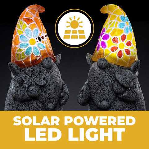 Chillin Gnomes Solar Powered LED Outdoor Light Set Of 2 For Garden Patio And Lawn with colorful mosaic hats lit at night.