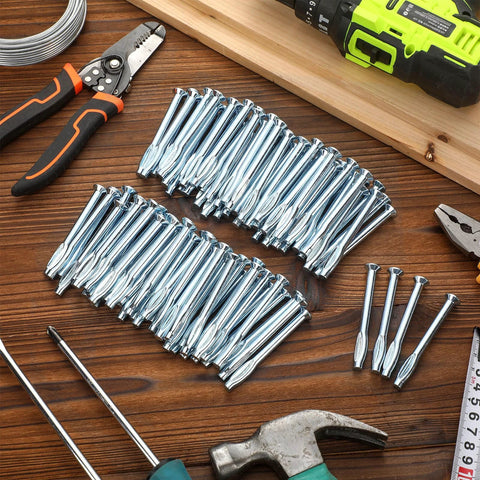 100 Pcs 1/4 Inch X 3 Inch Split-Drive Flat Zinc Plated Hammer-In Concrete Nails For Concrete And Cement Structures displayed on a table with tools.