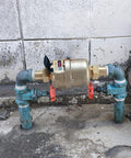 Installed Three Quarter Inch Non Pulsed Rotary Piston Water Meter with heavy duty brass construction for industrial cold water systems.