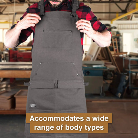 Person wearing Waxed Canvas Tool Apron For Woodworking Pros And DIYers, Heavy Duty Work Apron With Front Pockets in workshop
