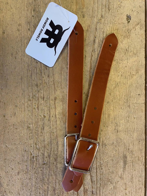Rodeo Ready Youth Leather Spur Straps For Kids, Adjustable with metal buckles on wooden surface, designed for secure fit