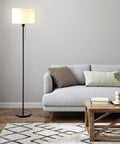 Dope Drum Shade Floor Lamp With Pull Chain On Off And E26 Socket Modern Minimalist Design next to grey sofa in living room