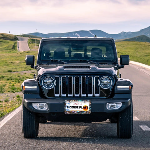Jeep with Abalone Shell License Plate Frame Made From Stainless Steel For Front And Rear Car Tags With Screws Durable 6.3 By 12.2 Inches Adds Unique Style To Your Ride For Women And Men A Fun Car Decoration Accessory on a scenic road.