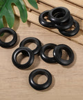 10 Pack Versatile Rubber Grommets 1 Inch ID 25mm Wire Hole Grommets Eyelet Ring Gasket on a table, suitable for home office use