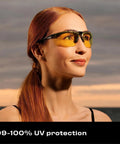 Woman wearing Yellow Safety Glasses For Men, ANSI Z87 Rated Shooting Eyewear with Scratch and Fog Resistant Lenses outdoors.