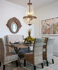 Dining room with Six Light French Empire Crystal Chandelier With Antique Bronze Finish For Farmhouse Ceiling Pendant Lighting.