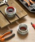 Pro Level Rock Solid 2 Piece Pack Of 2 Inch Watertight Conduit Hub Fittings Featuring Heavy Duty Rubber O Rings on wooden surface.
