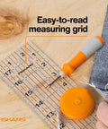 Seam Ready Sewing Ruler 3 By 18 Inch Acrylic Grid Ruler with highlighted seam allowances for fabric cutting on table.