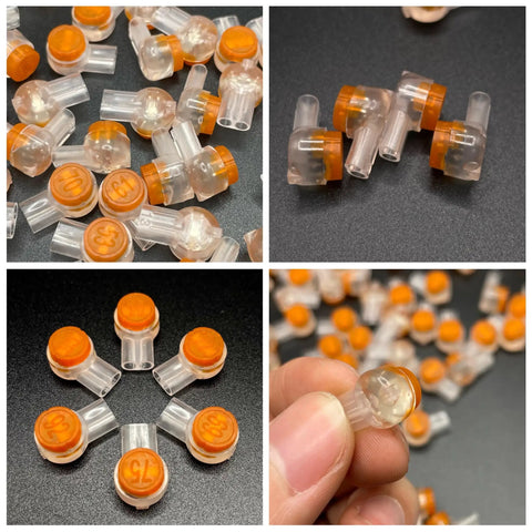 50 Pack UY2 K2 Gel Filled Waterproof IDC Wire Splice Connectors for 26-29 AWG wires, clear with orange top, close-up