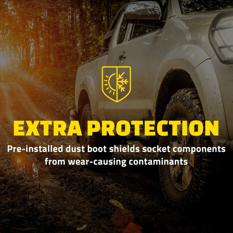 Pickup truck on dirt road highlighting extra protection against wear for front right lower suspension control arm and ball joint.