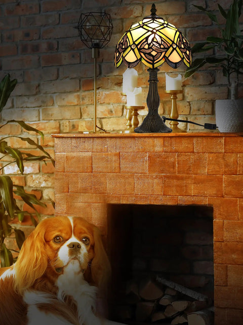 Irish Celtic Tiffany Style Stained Glass Table Lamp With 17500 Lumen Light on fireplace, dog sitting nearby