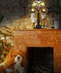 Tiffany Hummingbird Stained Glass Table Lamp With 16 Inch Wide Shade And 24 Inch Tall Body Antique Zinc Base In Bronze Finish Dual LED Bulbs UL Listed displayed on mantel