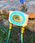 Two Zone Hose Timer For Garden And Lawn With LCD Display And Rain Delay Dual Outlet Sprinkler Controller attached to faucet