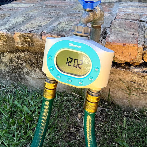 Two Zone Hose Timer For Garden And Lawn With LCD Display And Rain Delay Dual Outlet Sprinkler Controller attached to faucet