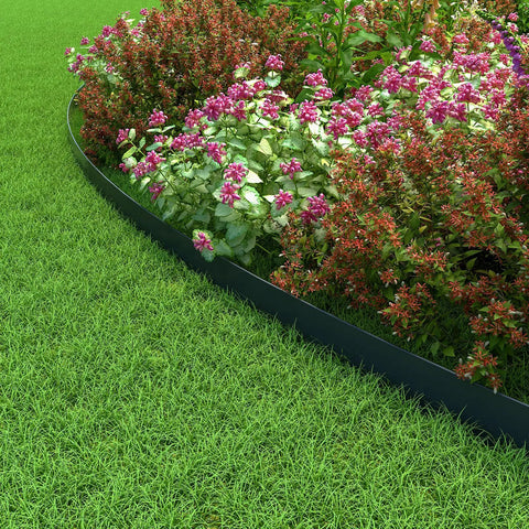 4 Inch Tall Landscape Edging Kit, 100 Ft Flexible Lawn Border With 99 Anchoring Spikes shown enclosing a flower bed.