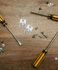 Stainless Steel Refrigerator Shelf Clips Snap On Mounts 8 Pack Brushed Surface with tools and screws on wooden surface