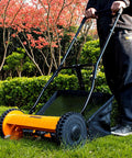 Person using 16 Inch 5 Blade Push Reel Lawn Mower with Removable Seven Point Nine Gallon Grass Catcher Sponge Grip