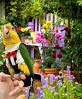 Parrot wearing Bird Diaper Harness Tuxedo Flight Suit With Waterproof Inner Layer For Parrots Cockatiels Conures Parakeets Macaws Budgies 80 Inch Flying Leash Ultra Comfortable And Durable Bird Gear in garden setting