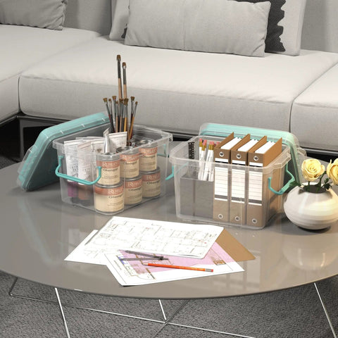 Clear Multi Layer Medicine Storage Box And First Aid Organizer for home office with handles, containing art supplies on a table.