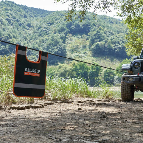 Vinyl Winch Cable Damper with High Visibility Reflective Strip for Safe Recovery on synthetic line in off-road terrain near Jeep