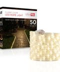 Led Rope Lights 50ft Classic Clear Warm White 3000K for indoor and outdoor use, box and coil shown, lighting a garden path.