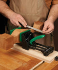 Rock Solid 6 Inch Quick Action Bench Vise With 300 Pound Clamping Power shown holding wood block with a file for shaping.