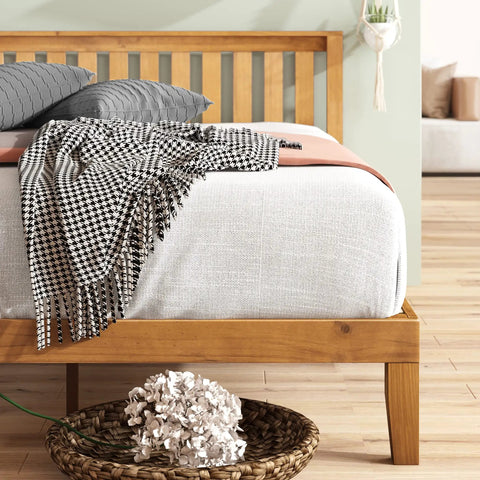 Top Tier Queen Platform Bed Frame With Tufted Fabric Headboard solid wood slats, heavy steel base, and stylish bedding.