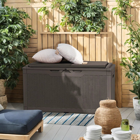98 Gallon Waterproof Resin Deck Box With Cushion Lockable Outdoor Storage Bench in deep brown on patio
