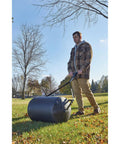 Man using Lawn Roller 18 Inch Diameter 24 Inch Wide Poly Drum Holds Up To 270 Lbs And 31.1 Inch Working Width For Versatile Push